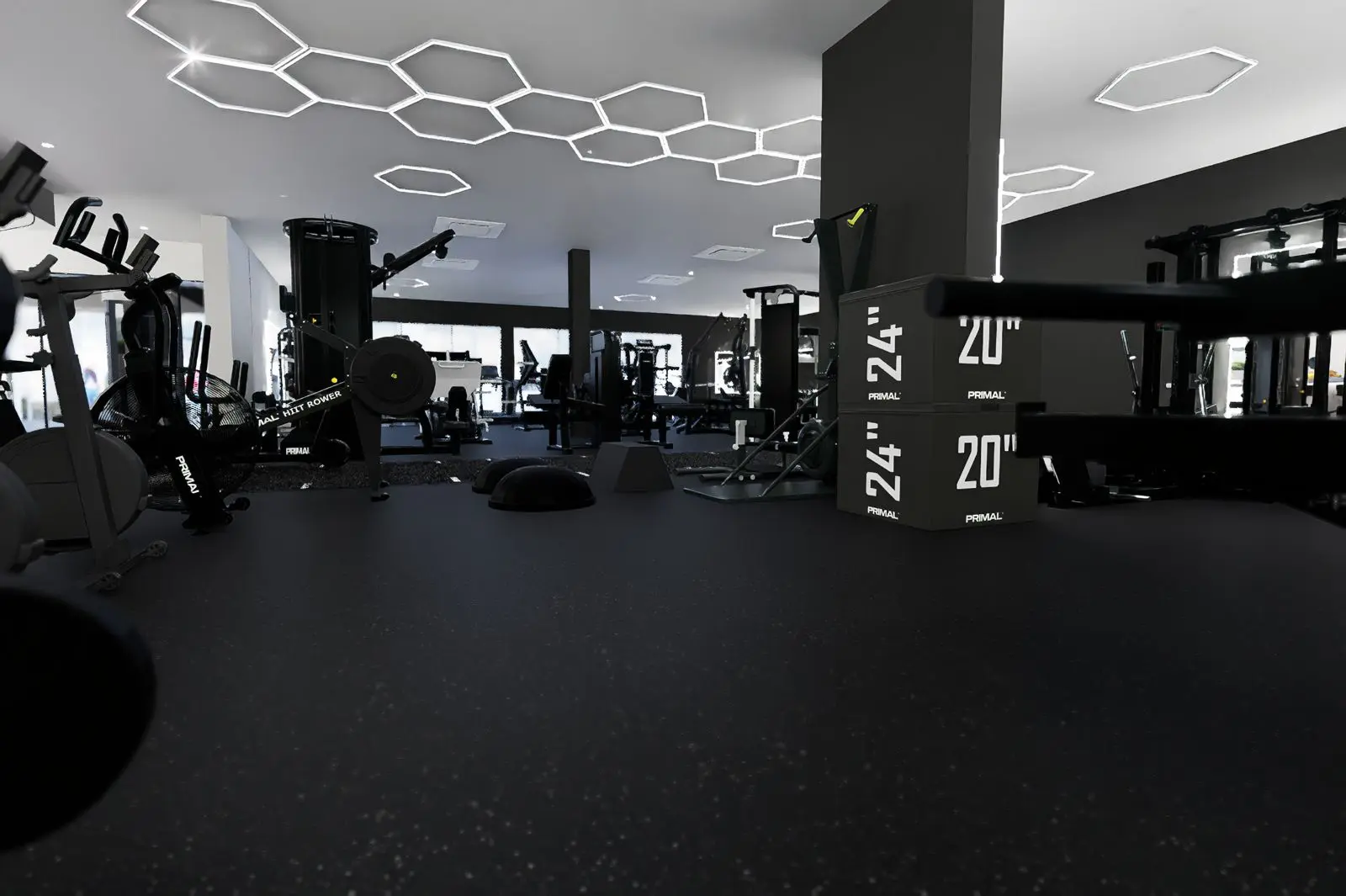TenTenBodyClub_gym-5_1600 Interior of TenTenBody Club, a luxury St. Maarten gym featuring Primal Strength equipment, functional training area, and modern geometric lighting design.